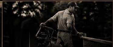 A landscaper unloading equipment